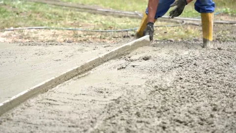 Workers make a concrete path Stock Footage 143899140