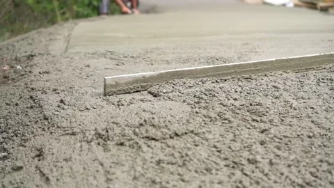 Workers make a concrete path Stock Footage 143899147