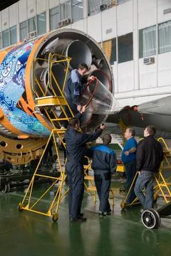 Workers make final preperations to a Soyuz TMA-11M spacecraft on Monday, No.. Stock Photos