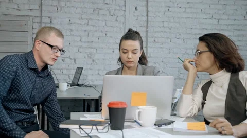 Workers making brainstorming research and using laptop computer Stock Footage 109211769