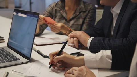 Workers making notes and talking about innovation in new startup Stock Footage 113633270