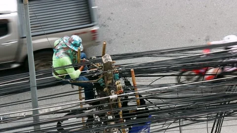 Workers managed and organized messy, unused cord installed on the pole. Stock Footage 221251041