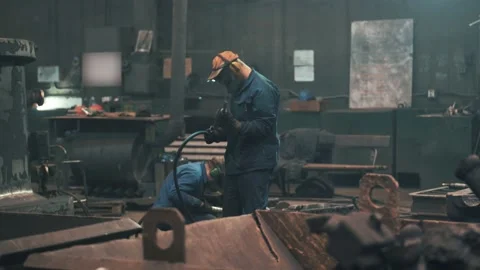 Workers in masks work in workshop of metallurgical foundry Stock Footage 153116897