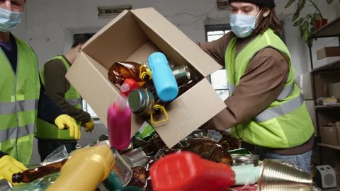 Workers Materials Recovery Facility sort recyclable waste into paper plastics Stock Footage 229600405