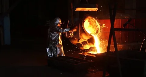Workers melt and pour metal from a ladle, sparks Stock-Footage 111865285