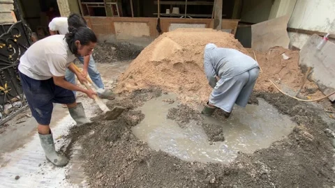 Workers mixing concrete Stock Footage 308915167