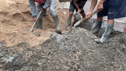 Workers mixing concrete Stock Footage 308915459