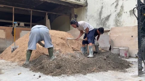 Workers mixing concrete Stock Footage 308915541