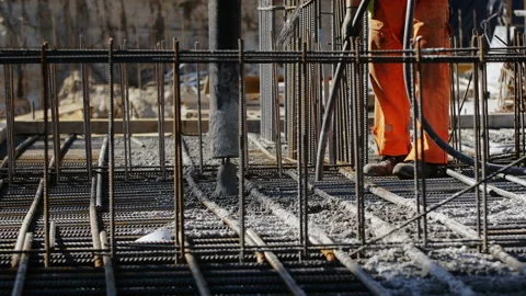 Workers on a modern construction site making steel reinforcement Stock Footage 89911696
