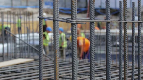 Workers on a modern construction site making steel reinforcement Stock Footage 89914351