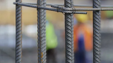 Workers on a modern construction site making steel reinforcement Stock-Footage 89914962
