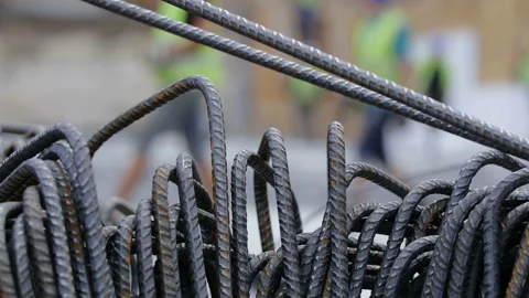 Workers on a modern construction site making steel reinforcement Stock-Footage 89916551