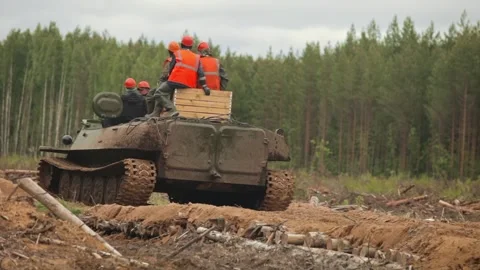 Workers on the Move. Tank-Treaded Terrain Crossing Stock Footage 263539293