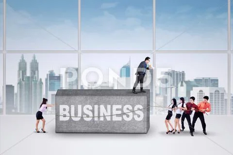 Workers moving a business burden Stock Photos