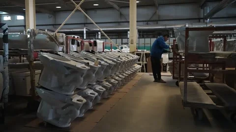 Workers moving ceramic bathroom components in a production workshop Stock Footage 322712219