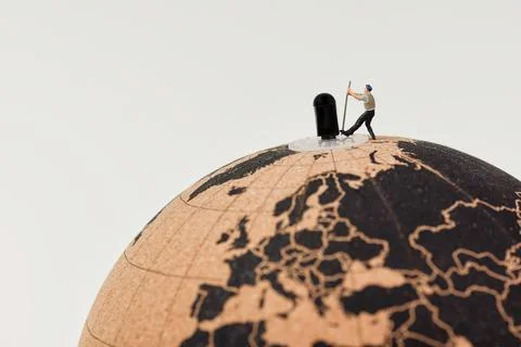 Workers moving globe axis with crowbar Stock Photos