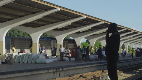 Workers moving goods on the platform of railway station.DaresSalaam Tanzania Stock Footage 132228771
