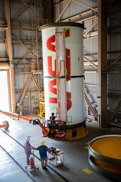 Workers with NASAs Exploration Ground Systems (EGS) finishes the first co.. Fotos de archivo