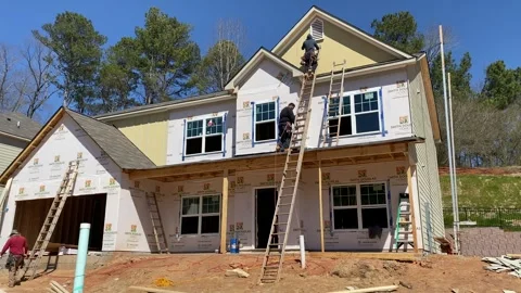 Workers in a New House Construction 1 (Thursday, March 4, 2021. Dacula GA) Stock Footage 257516710