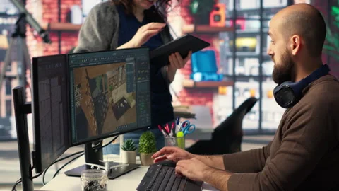 Workers in office use CAD software to design a house interior Video stock 308607110