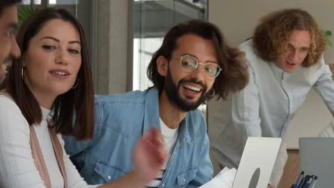 Workers in an office working as a team happily. Coworking, startup. Video stock 158459835