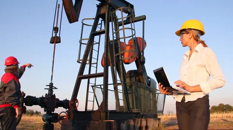 Workers in an Oilfield, teamwork Stock Footage 34637661