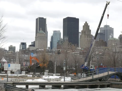 Workers operate crane in Montreal Stock Footage