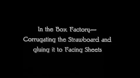 Workers operate heavy large machines in order to make corrugated fiber at a Stock Footage 99361538