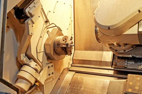 Workers in the operation of cnc machine tools Stock Photos