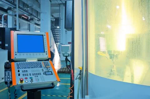 Workers in the operation of cnc machine tools Stock Photos