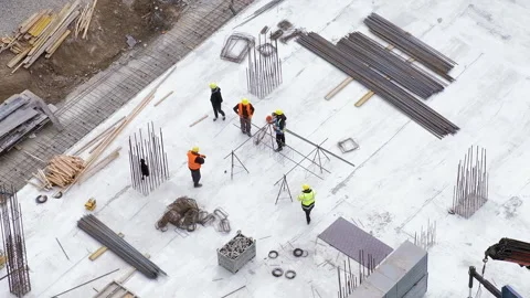 Workers in orange and yellow uniform at the construction site, top view Stock Footage 236473459
