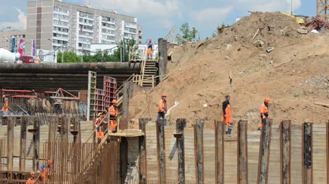 Workers in orange uniforms and helmets moved. Stock Footage 24708478