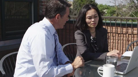 Workers ordering lunch and working on laptop Stock-Footage 67352008