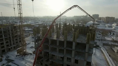 Workers in overalls work at the construction site Stock Footage 81942529