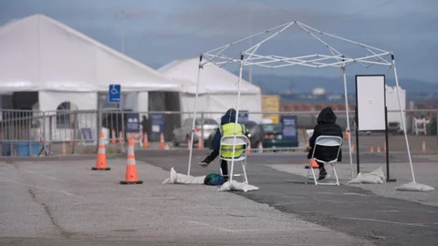 Workers oversee covid test site Stock Footage 129523406