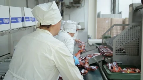 Workers pack ice cream at the factory Stock Footage 74506123