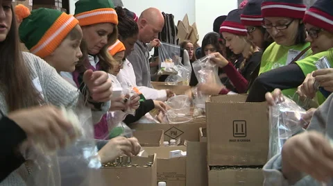Workers packaging aid and supplies for homeless people living on the streets Stock-Footage 46002839