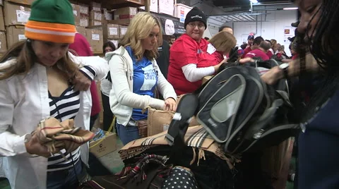 Workers packaging aid and supplies for homeless people living on the streets Stock Footage 46003244