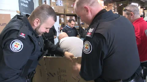 Workers packaging aid and supplies for homeless people living on the streets Stock Footage 46003805