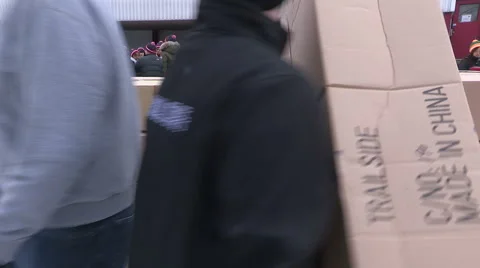 Workers packaging aid and supplies for homeless people living on the streets Stock Footage 46004669