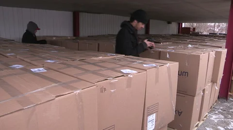 Workers packaging aid and supplies for homeless people living on the streets Stock Footage 46005454