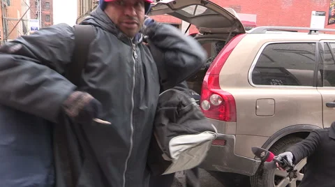 Workers packaging aid and supplies for homeless people living on the streets Stock Footage 46007567