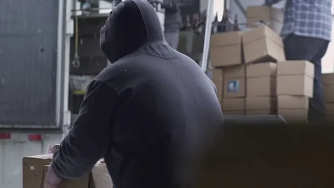 Workers packaging beer bottles into boxes Stock Footage 77078964