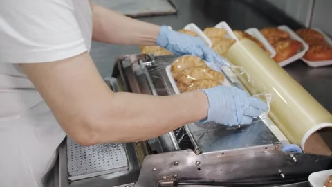 Workers Packaging Pirozhki on Production Line. Stock Footage 321735697