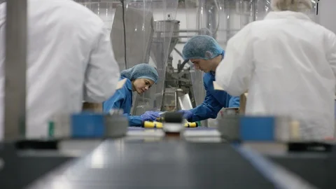 Workers packing cosmetics in boxes in cosmetic factory Stock Footage 107991018