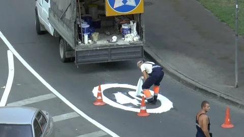 Workers paint traffic sign Stock Footage 95325911