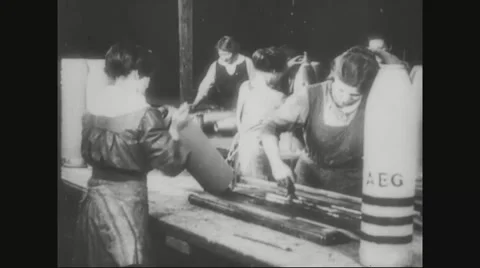 Workers painting the metal casing of missile Stock Footage 43312349