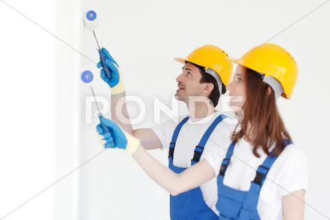 Workers painting wall Stock Photos