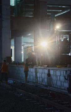 Workers part two with beaming lights Foto stock