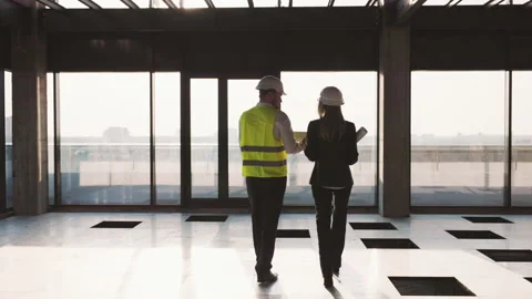 Workers Partners Holding Drawing Plan Walking at Modern Unfinished Business Stock Footage 234081511